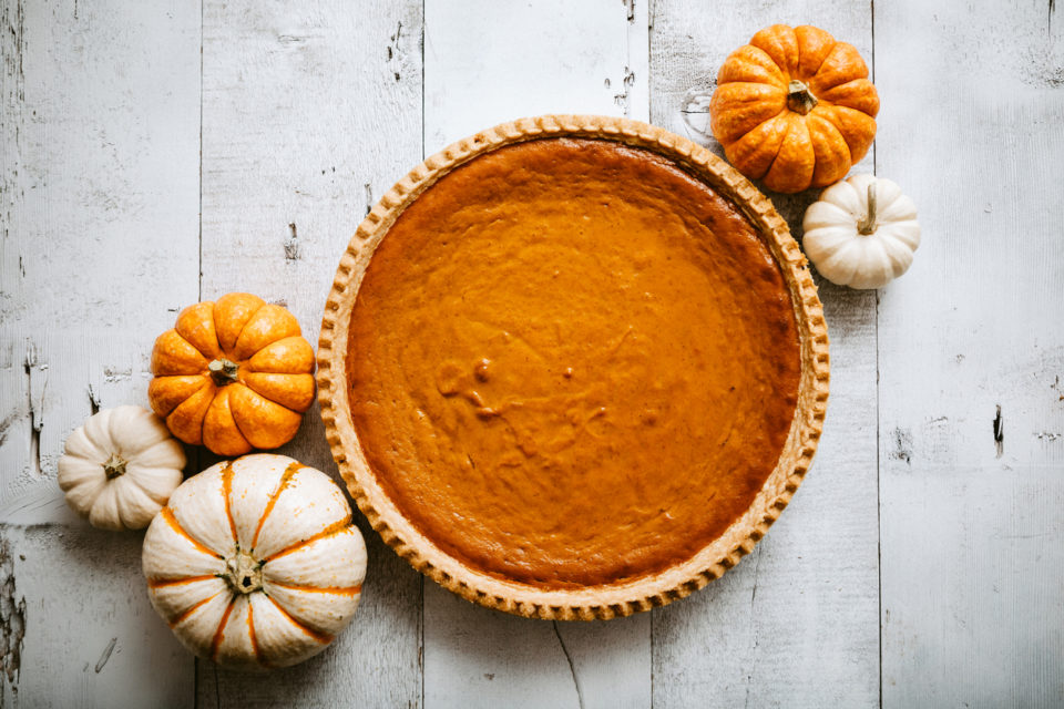 Pumpkin Pie on Rustic Background